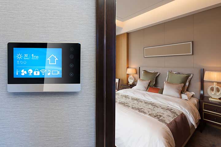 An Introduction To Home Automation NJ, smart screen on wall in modern luxury bedroom