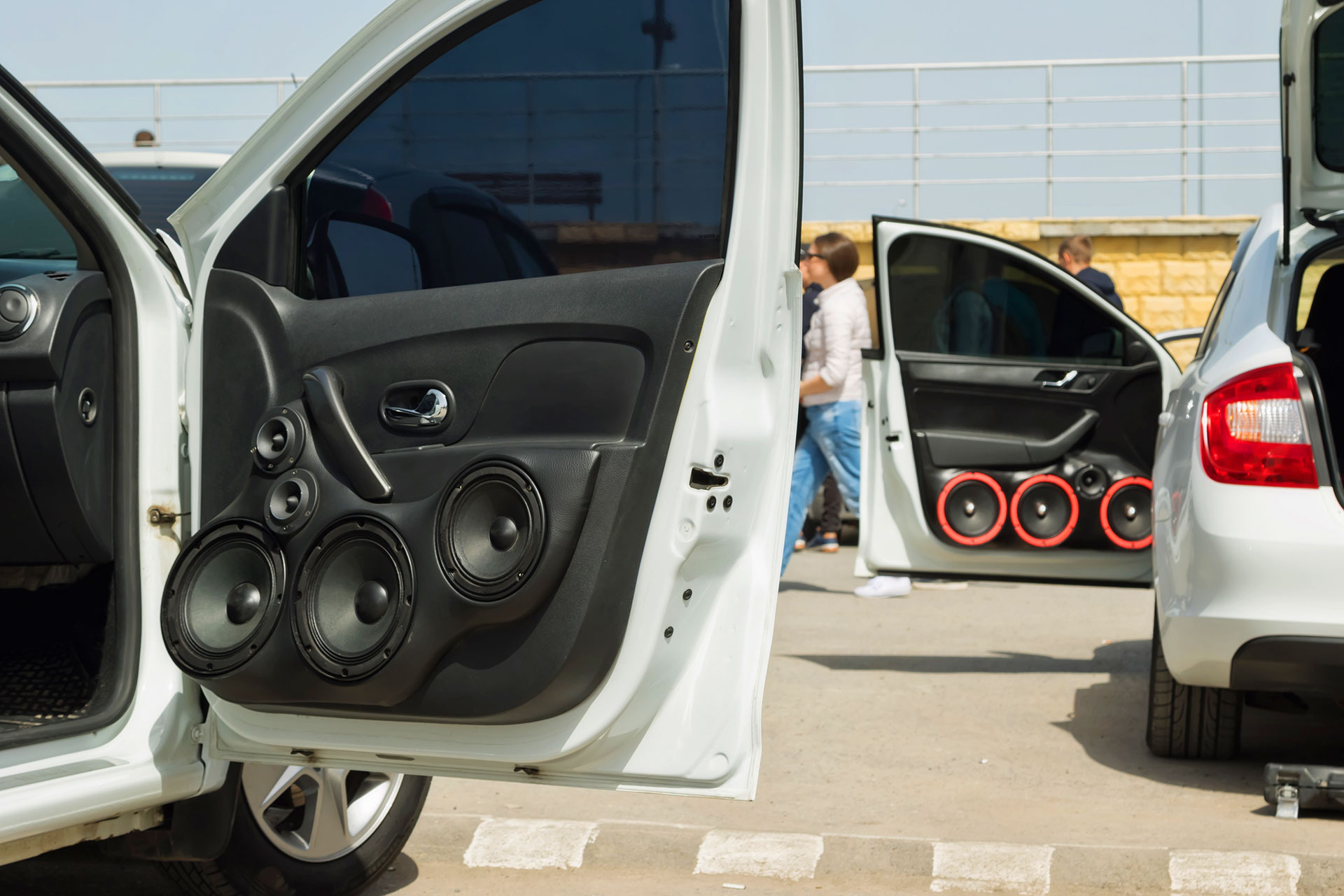Custom car door panel fitted with multiple aftermarket speakers