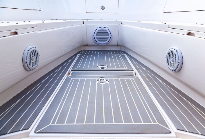 Marine boat deck with built in speakers and teak flooring