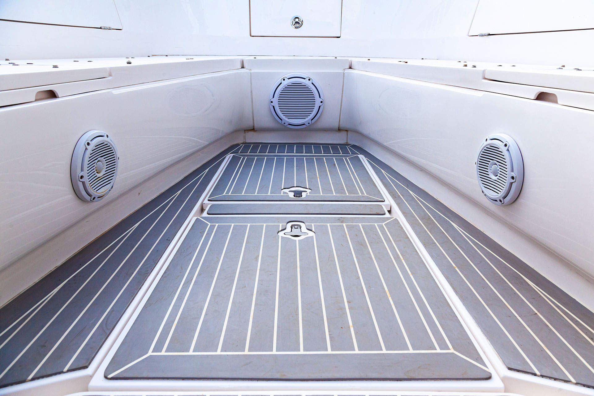 Marine boat deck with built in speakers and teak flooring
