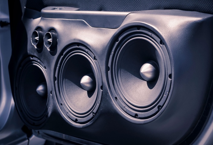 Custom car door panel with dual subwoofers and tweeters installed