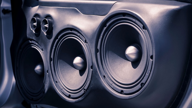 Custom car door panel with dual subwoofers and tweeters installed